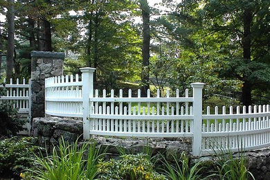 Inspiration for a mid-sized traditional shade backyard mulch landscaping in Boston.