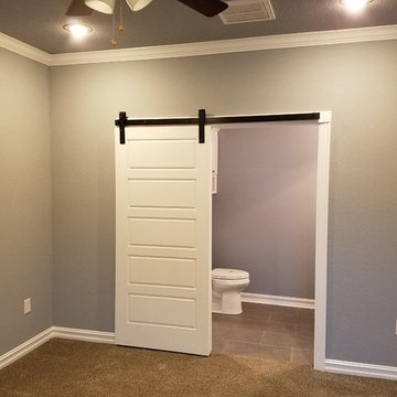 Extra wide "barn" door between master bedroom and master bath.