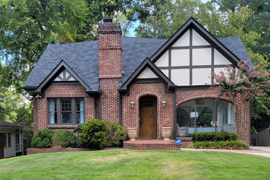 Example of a three-story exterior home design in Atlanta