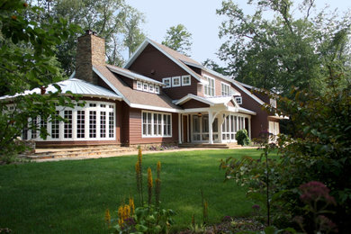 Example of a trendy two-story exterior home design in Other