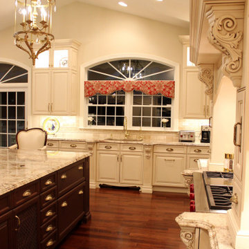 Luxurious Mediterranean Kitchen With A Custom Wood Hood And Cherry Wood Island
