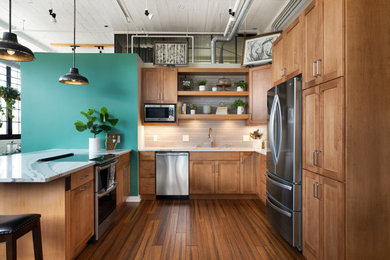 Eat-in kitchen - mid-sized contemporary u-shaped dark wood floor, brown floor and exposed beam eat-in kitchen idea in Minneapolis with an undermount sink, shaker cabinets, medium tone wood cabinets, quartz countertops, beige backsplash, ceramic backsplash, stainless steel appliances, an island and white countertops