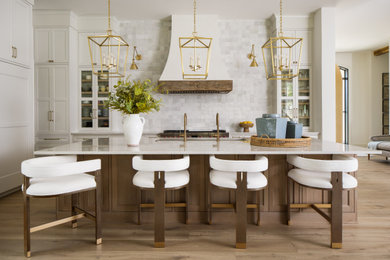 Open concept kitchen - large transitional l-shaped light wood floor and brown floor open concept kitchen idea in Dallas with an undermount sink, beaded inset cabinets, white cabinets, quartzite countertops, white backsplash, ceramic backsplash, paneled appliances, an island and white countertops