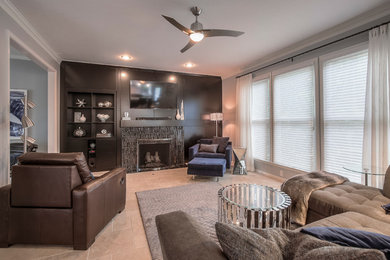 Example of a large minimalist open concept travertine floor living room design in Kansas City with gray walls, a standard fireplace, a tile fireplace and a wall-mounted tv
