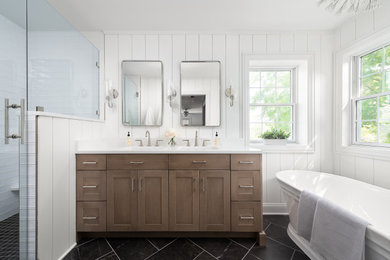 Inspiration for a mid-sized transitional master white tile and cement tile porcelain tile, black floor, double-sink and shiplap wall bathroom remodel in Chicago with shaker cabinets, medium tone wood cabinets, a two-piece toilet, white walls, an undermount sink, quartz countertops, a hinged shower door, white countertops, a niche and a built-in vanity