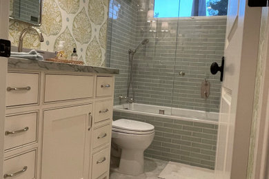 Inspiration for a cottage subway tile mosaic tile floor, white floor, single-sink and wallpaper bathroom remodel in Other with green walls and a hinged shower door