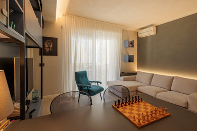Foto di un piccolo soggiorno design chiuso con pareti blu, pavimento con piastrelle in ceramica e pavimento marrone