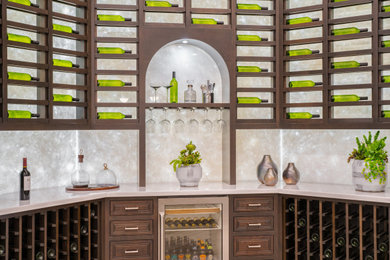 Wet bar - large traditional u-shaped wet bar idea in San Francisco with raised-panel cabinets and dark wood cabinets