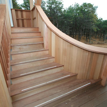 The curved stair whimsically joins the two buildings.