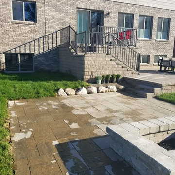 Three Tiered Unilock Patio on a waterfront.