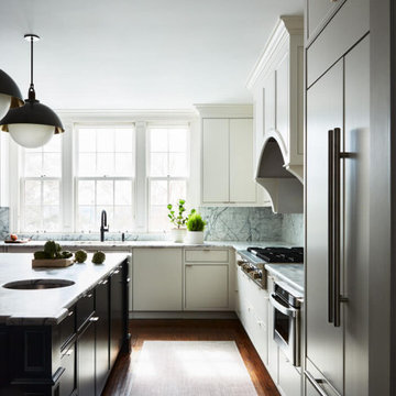 White Kitchen with Black Island and Allied Maker Lighting