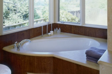 Large elegant master beige tile light wood floor and brown floor bathroom photo in San Francisco with medium tone wood cabinets, a two-piece toilet, beige walls, flat-panel cabinets and an undermount sink