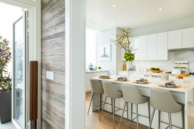 Photo of a modern kitchen in Philadelphia with flat-panel cabinets.