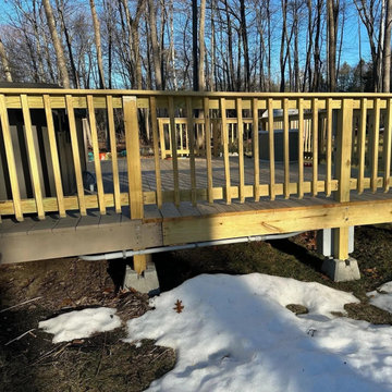 The feed to the hot tub is run in conduit neatly along the deck framing, not lef