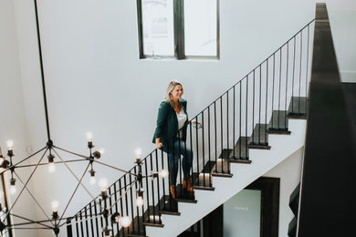 Example of a large trendy wooden straight metal railing staircase design in Toronto with wooden risers