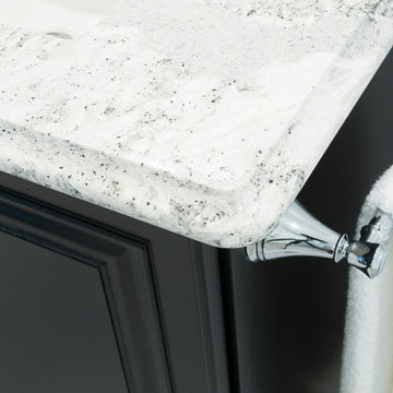 Vanity towel rack on traditional dark wood vanity