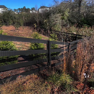 Black four rail gate with wire