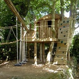 Amazing woodland play area with a curved climbing wall, slides and rope bridge. - Garden Playhouses