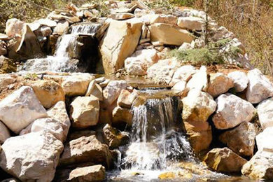 Design ideas for a large traditional partial sun front yard water fountain landscape in Salt Lake City.