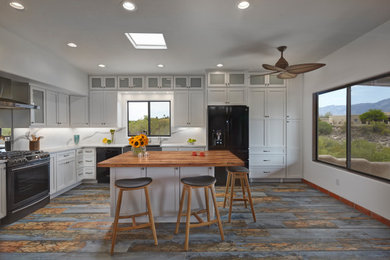 Design ideas for a transitional kitchen in Phoenix with with island.