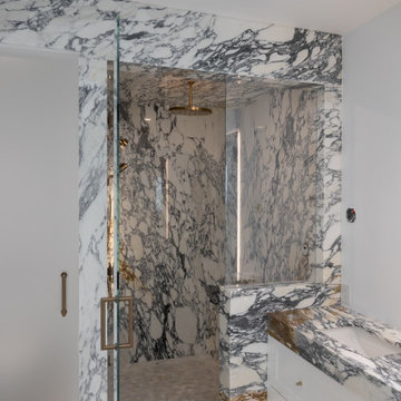 Vein-Matched Arabescato Corchia Vanity and Shower Walls