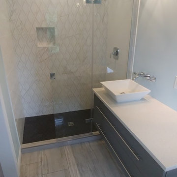 MODERN STYLE VANITY AND TILED SHOWER