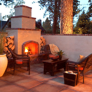 Traditional courtyard patio in Portland with a fire feature.