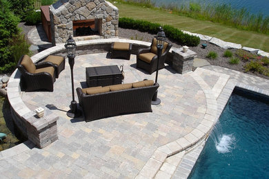 Example of a large concrete paver patio design in Detroit