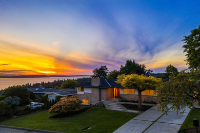 Large 1950s two-story concrete fiberboard house exterior photo in Seattle