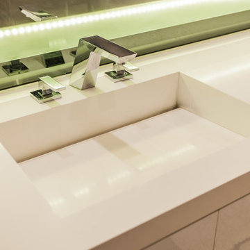 Chrome Widespread Faucet on Backlit Vanity Sink