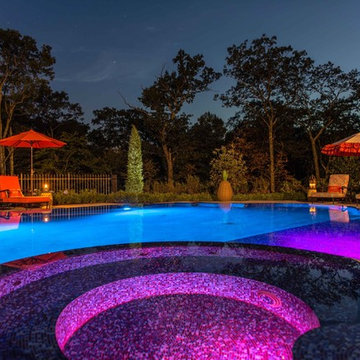 Night View of Infinity Edge Perimeter Overflow Pool and Spa Design with Color LE