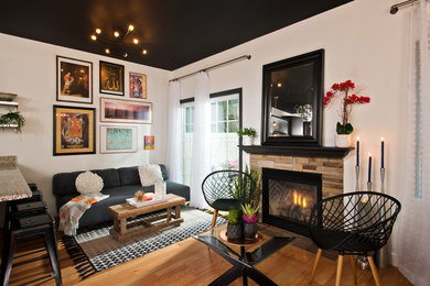Living room - small contemporary open concept medium tone wood floor and brown floor living room idea in Other with white walls, a standard fireplace, a stone fireplace and no tv
