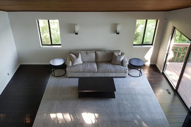 Living room - mid-sized contemporary formal and open concept dark wood floor and brown floor living room idea in New York with white walls, no fireplace and no tv
