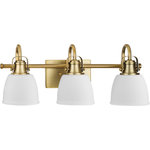 Progress Lighting - Preston Collection Three-Light Coastal Vintage Brass Bath and Vanity Light - Preston features industrial inspired details paired with elegant opal glass for comfortable illumination in the bath, and fits beautifully into farmhouse, coastal and transitional settings. The decorative frame includes a softly curved metal support with authentically crafted hardware elements.