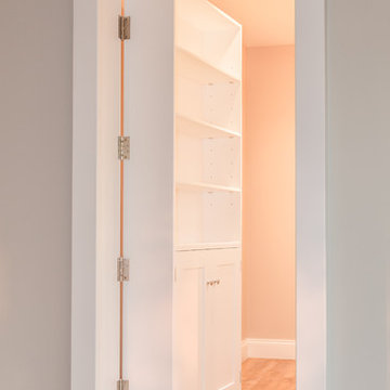 Secret bookcase door, TV unit and Monk's bench hallway storage
