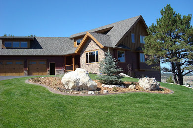 Example of a large mountain style brown three-story mixed siding exterior home design in Other with a shingle roof