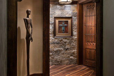 Photo of an entryway in Denver with medium hardwood floors and a medium wood front door.