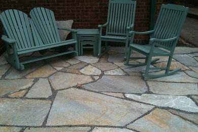Inspiration for a mid-sized traditional backyard patio in Minneapolis with no cover.