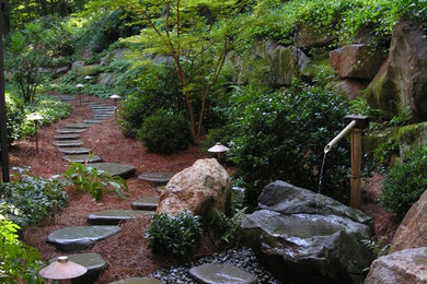 Design ideas for a large traditional garden in Philadelphia with a water feature.