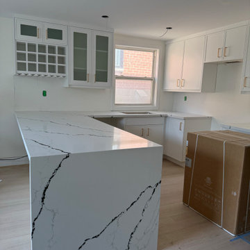 White Slim Shaker Kitchen with Waterfall Peninsula
