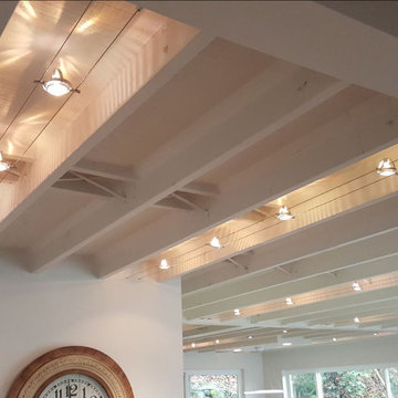 Modernize old two story home, expand over existing garage