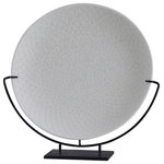 Harp and Finial - Rafina Charger Cream Finish on Ceramic with Black Metal Base - Sure to accentuate transitional decor, the Rafina Charger showcases a ceramic plate with a cream finish supported by a black metal base. Display this decorative charger in a living room, kitchen, or dining room. With its neutral colors of black and cream and its smooth round shape, this decorative plate is ready to add style to any space.