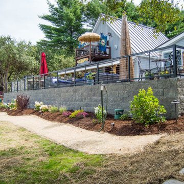 Outdoor Kitchen, Firepit, Patio, Stairs, Retaining Wall and Flowerbeds