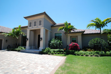 Example of a transitional exterior home design in Miami