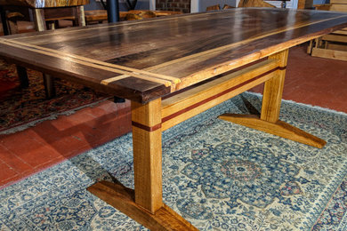 Walnut and oak minimalist trestle style table