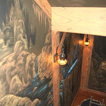 The Bat Cave Themed Mural in a stairway and lower level by Tom Taylor