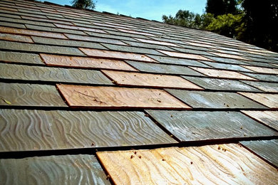 Inspiration for a large modern multicolored two-story house exterior remodel in San Francisco with a hip roof and a metal roof