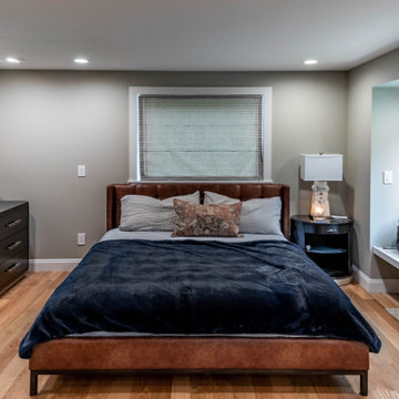 Spacious Gray Bedroom with Seating Area