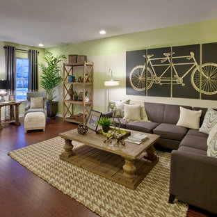 Design ideas for a traditional living room in New York with green walls and dark hardwood flooring.