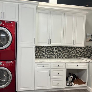 Laundry Room design with extra dryer and maximized storage space